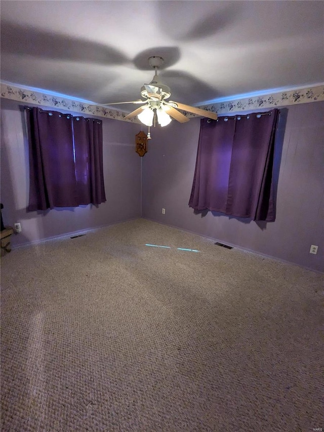 carpeted empty room with ceiling fan