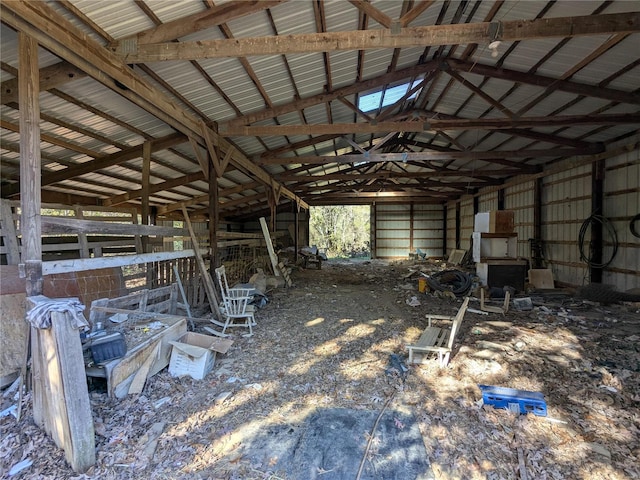 miscellaneous room featuring vaulted ceiling with beams