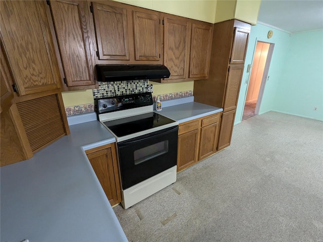 kitchen featuring white range with electric stovetop, decorative backsplash, and light colored carpet