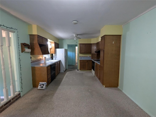 kitchen featuring sink, ceiling fan, light colored carpet, white refrigerator, and black dishwasher