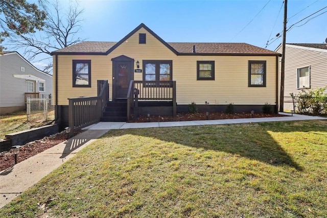 bungalow-style house featuring a front yard