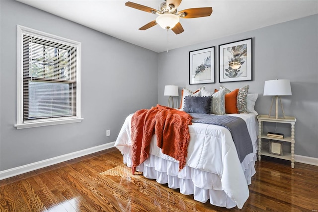 bedroom featuring dark hardwood / wood-style floors and ceiling fan