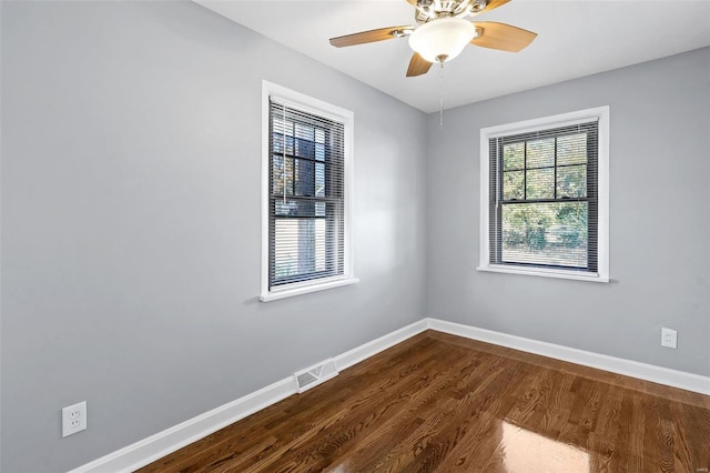 empty room with ceiling fan and wood-type flooring