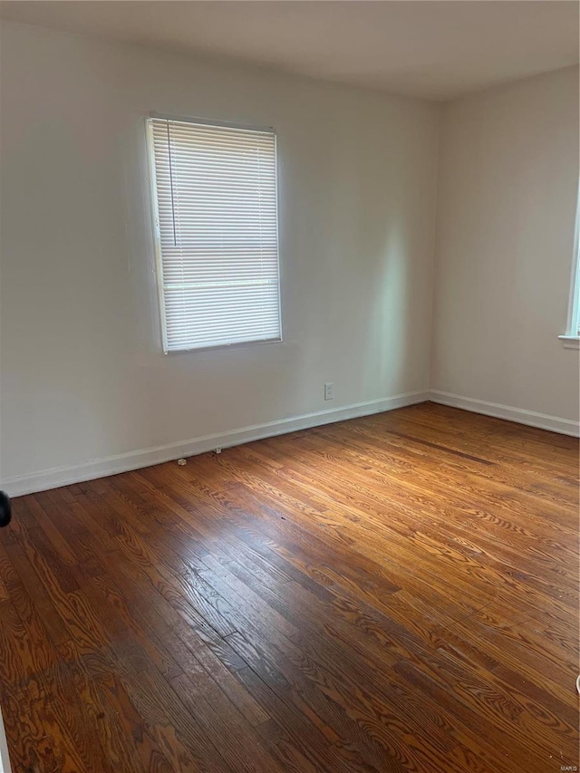 spare room with hardwood / wood-style flooring