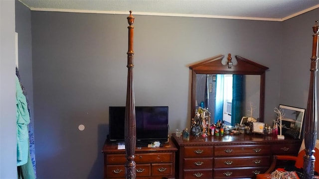 bedroom with crown molding