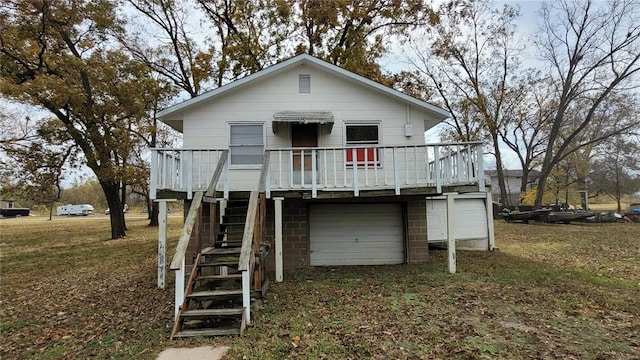 view of front of house featuring a front lawn, a wooden deck, and a garage