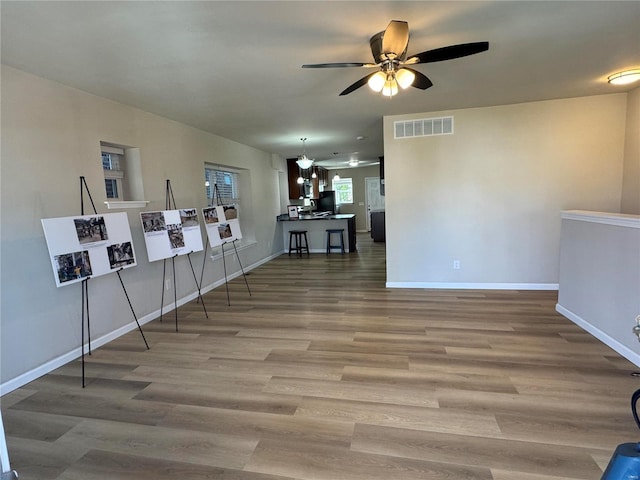 interior space featuring ceiling fan and hardwood / wood-style flooring