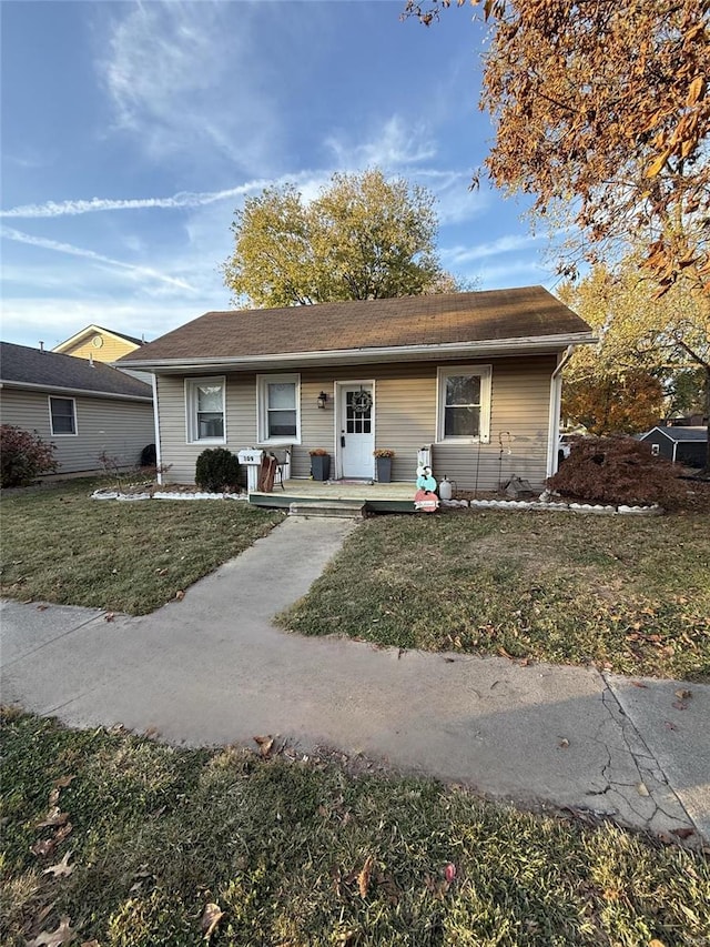 ranch-style home with a front lawn