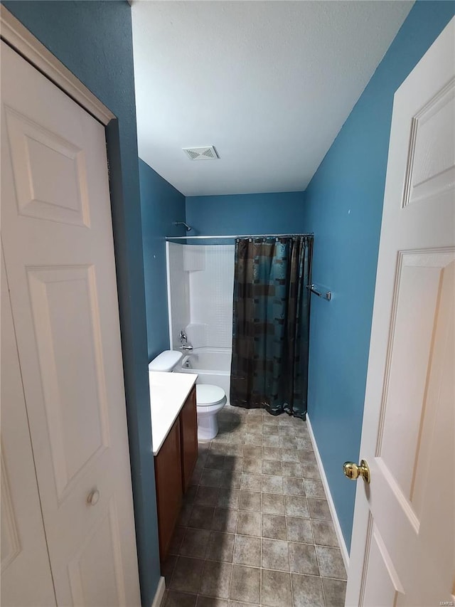 full bathroom featuring shower / bath combo with shower curtain, vanity, and toilet