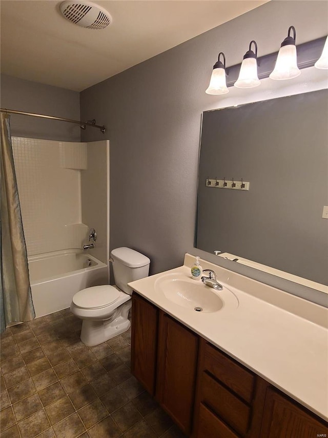 full bathroom with vanity, toilet, and shower / tub combo with curtain