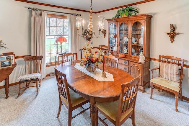 dining space featuring light carpet, crown molding, and an inviting chandelier