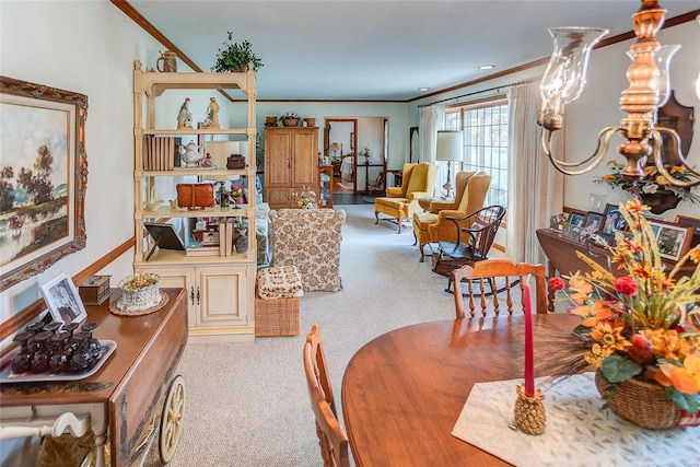 dining room featuring ornamental molding and light colored carpet