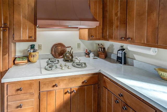 kitchen featuring white gas cooktop and range hood