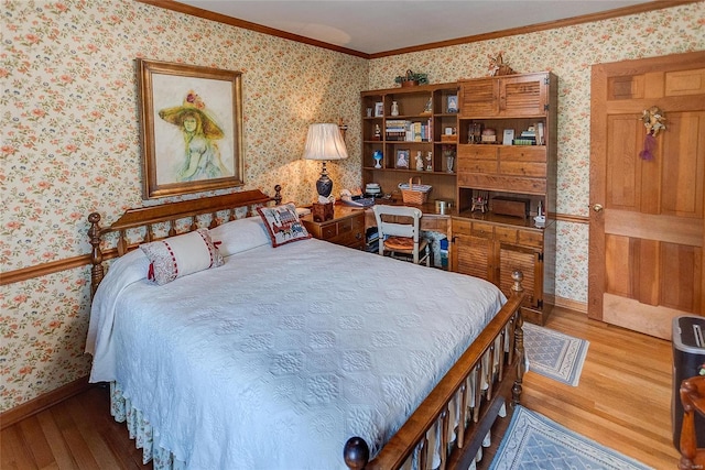 bedroom featuring hardwood / wood-style flooring and ornamental molding