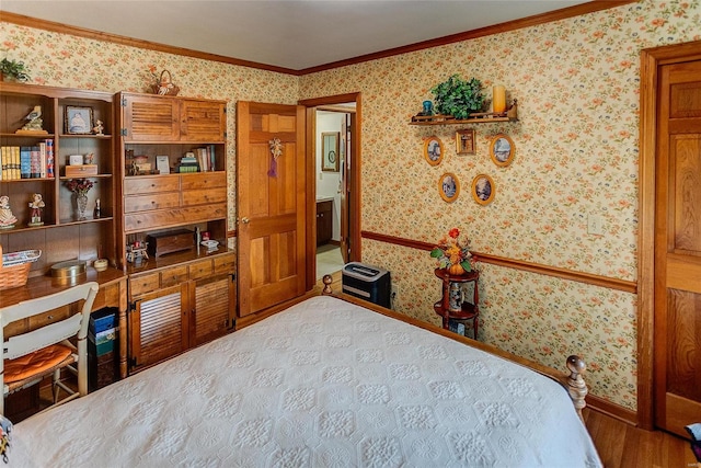 bedroom featuring ornamental molding and wood-type flooring