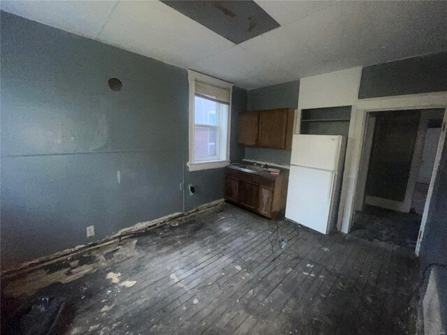 kitchen featuring sink and white refrigerator