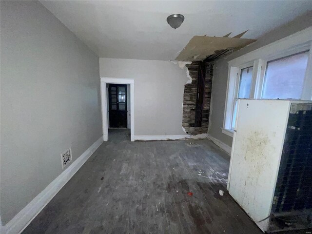 unfurnished living room featuring dark hardwood / wood-style flooring