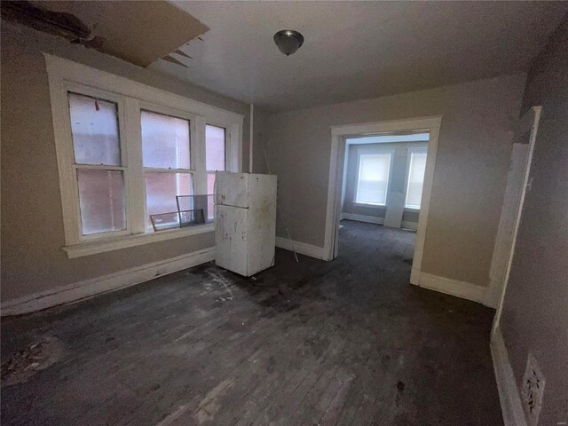 empty room with dark wood-type flooring