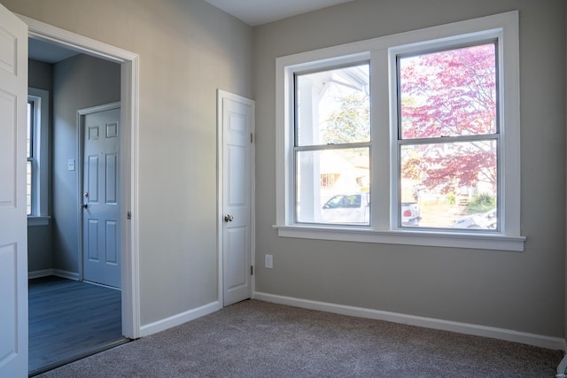 unfurnished bedroom with a closet and carpet flooring