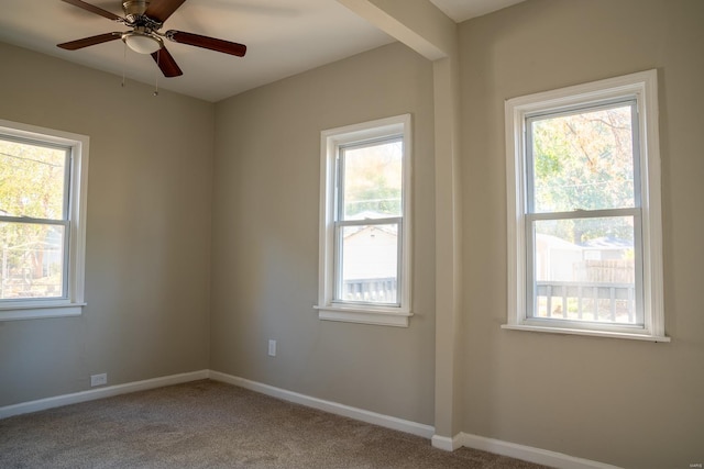 unfurnished room with ceiling fan and carpet floors