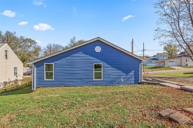 view of side of property featuring a yard