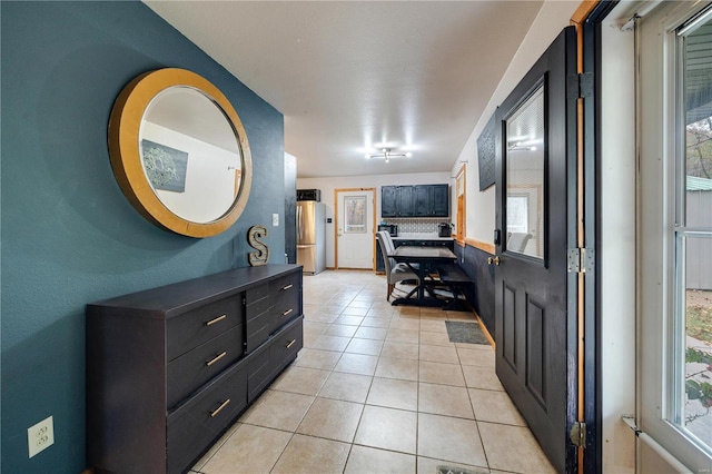 tiled entryway featuring plenty of natural light