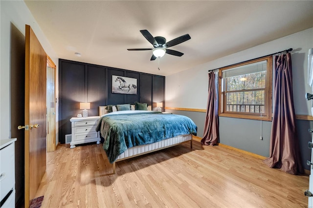 bedroom featuring light hardwood / wood-style floors and ceiling fan