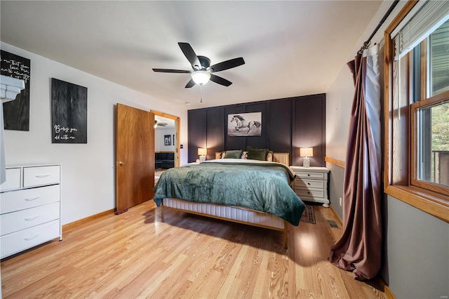 bedroom featuring ceiling fan and light hardwood / wood-style flooring