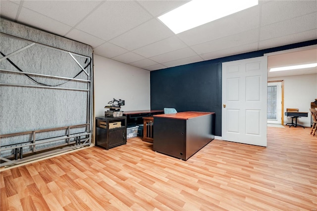 office space featuring a drop ceiling and wood-type flooring