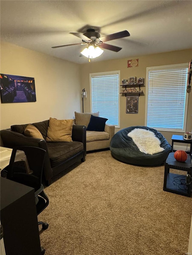 living room featuring carpet flooring and ceiling fan