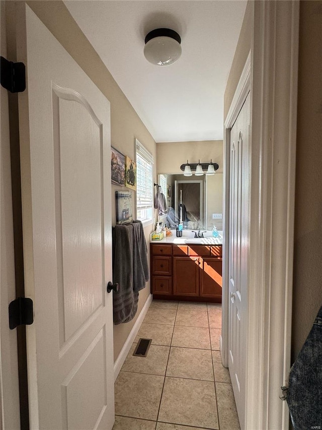 bathroom with vanity and tile patterned floors