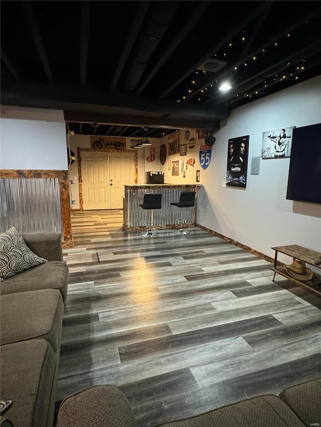 interior space featuring hardwood / wood-style flooring and indoor bar