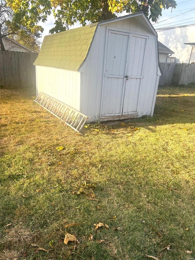 view of outbuilding featuring a yard