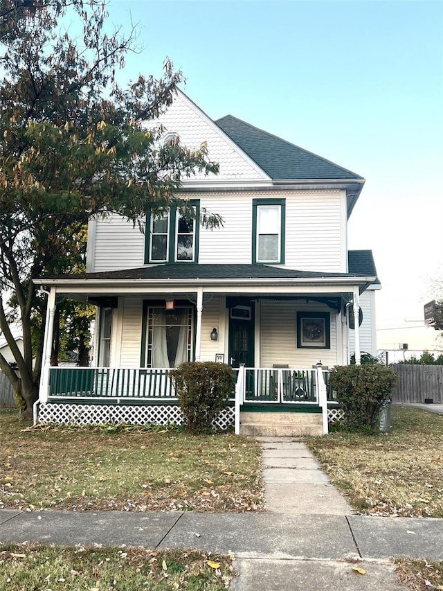 farmhouse inspired home with a porch