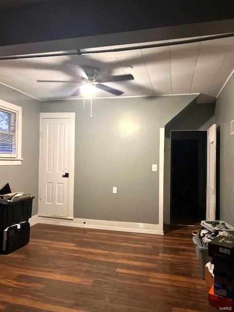 spare room featuring dark hardwood / wood-style floors and ceiling fan