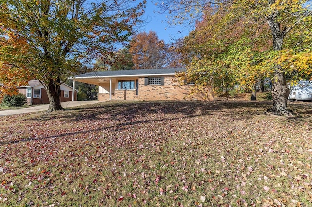 view of front of property featuring a carport