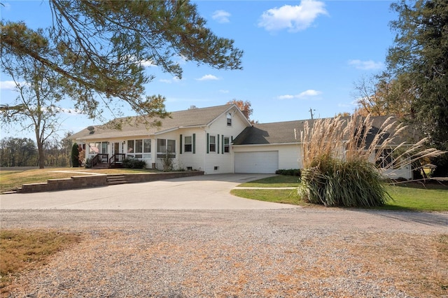 view of front of house featuring a front yard and a garage