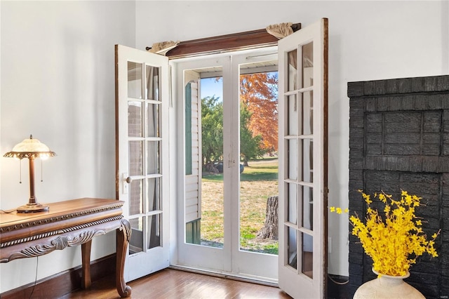 doorway to outside with french doors, hardwood / wood-style flooring, and a healthy amount of sunlight