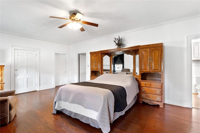 bedroom with dark hardwood / wood-style flooring, crown molding, connected bathroom, and ceiling fan