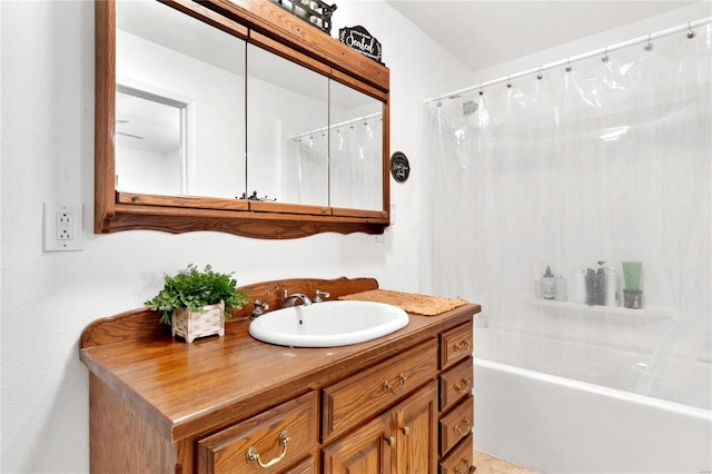 bathroom with vanity and shower / bath combination with curtain