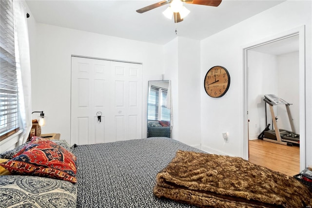 bedroom featuring wood-type flooring, a closet, and ceiling fan