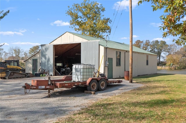 view of outbuilding with a yard