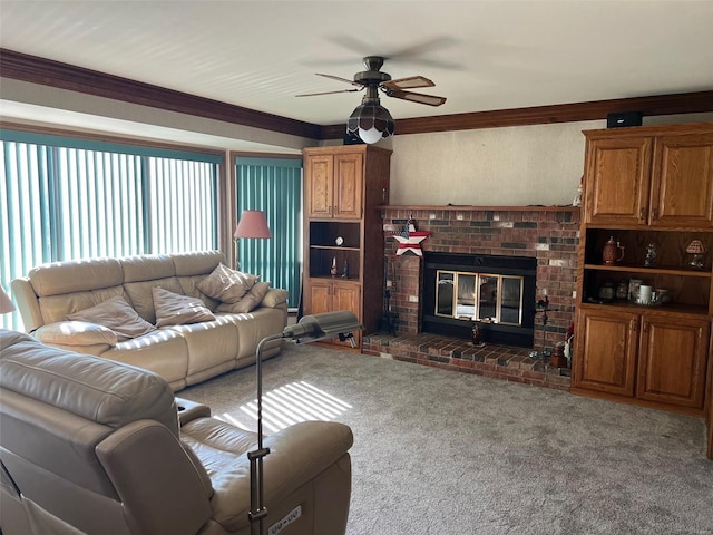 living room featuring ornamental molding, carpet, a brick fireplace, and ceiling fan