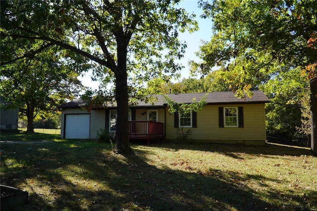 ranch-style home with a front yard and a garage