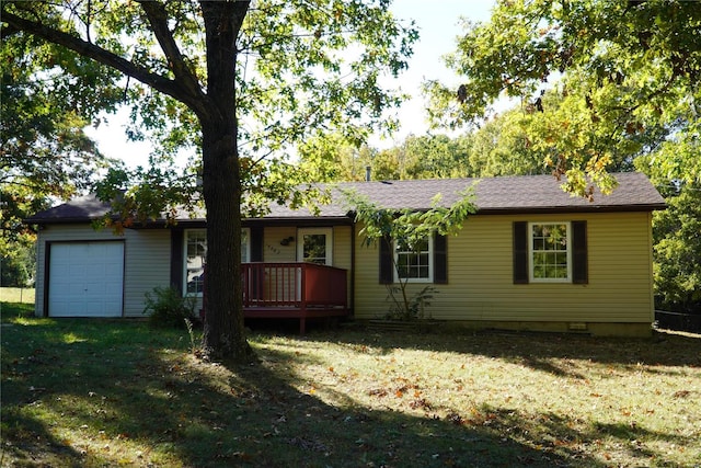 single story home with a front yard and a garage