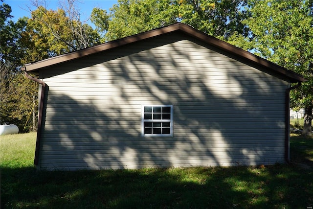 view of property exterior with a lawn