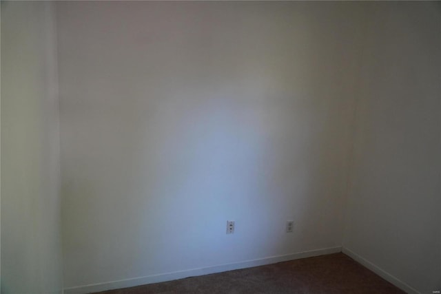 unfurnished room featuring carpet