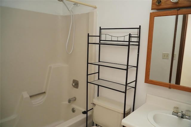 full bathroom featuring toilet, vanity, and  shower combination