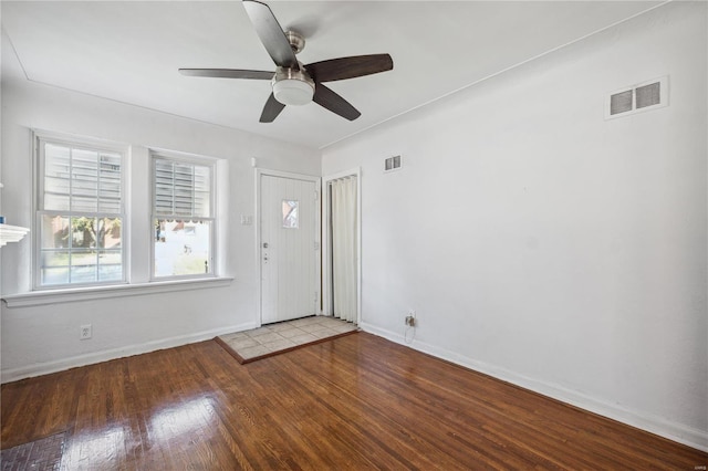 foyer featuring wood-type flooring and ceiling fan