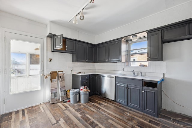 kitchen with dishwasher, decorative backsplash, dark hardwood / wood-style flooring, and sink